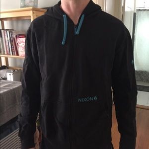 Black and blue zip up Nixon hoodie